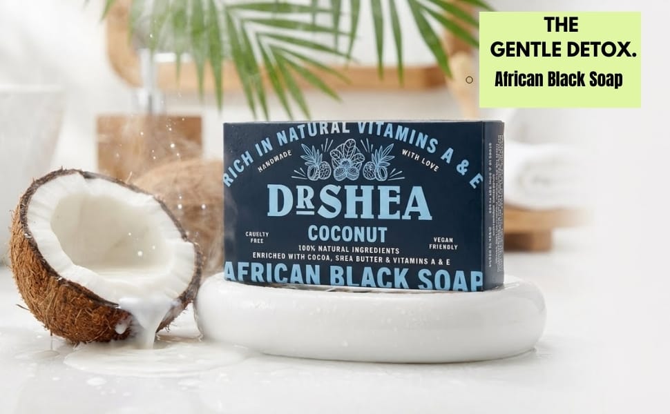 Coconut African Black Soap Dr. Shea Coconut African Black Soap bar ON WHITE SOAP DISH with raw coconut and PALM LEAVES